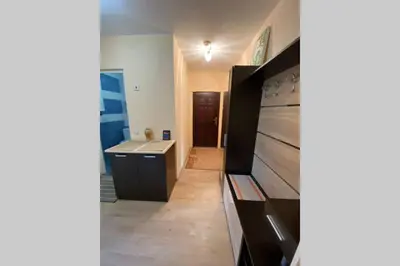 a kitchen with a sink and a refrigerator at Sunny apartment by the river in Sandanski