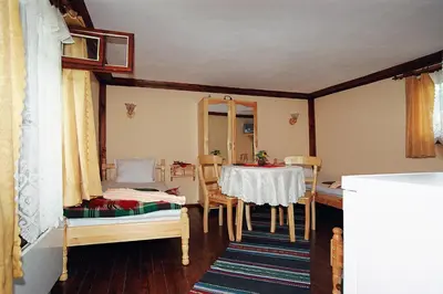 a room with a table and a dining room at Янко Кехая in Koprivshtitsa
