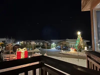 a view of a christmas tree in a yard at night at Pirin Golf Hotel Private Studios - Sani, Bansko in Razlog
