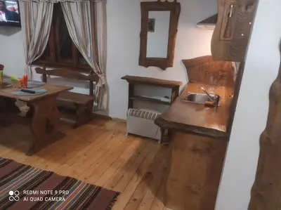 a kitchen with a sink and a wooden counter at Вила 111 in Sapareva Banya