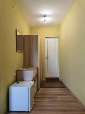 a kitchen with a white refrigerator and a door at Дамяновата къща in Sapareva Banya