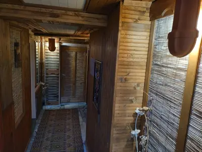 a hallway of a home with wooden walls at Къща за гости Вишнева градина in Brestnik