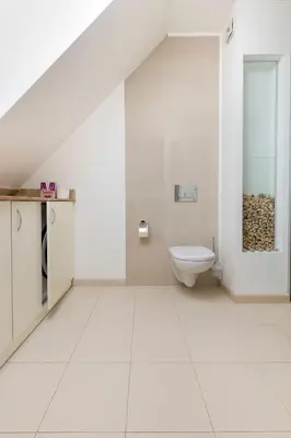a white bathroom with a toilet and a sink at 1BD Flat with a lovely terrace in the centre of Plovdiv by Flat Mаnager in Plovdiv