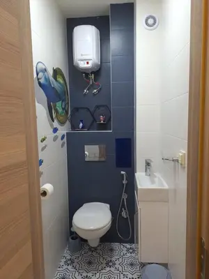 a small bathroom with a toilet and a sink at Cloud 6 -Top Center,360° view,Free private parking in Plovdiv