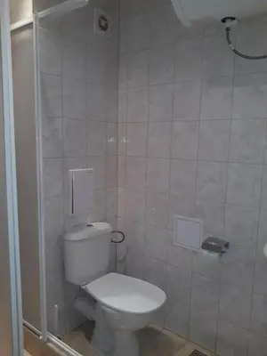a bathroom with a toilet and a shower at Старият Хан-Б24 in Bansko