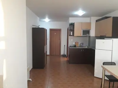 a kitchen with a black refrigerator in a room at Старият Хан-Б24 in Bansko