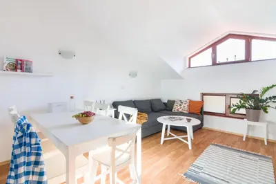 a living room with a couch and a table at Todorka Apartments in Bansko in Bansko