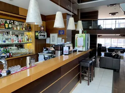 a bar in a restaurant with a counter at Luxury Apartment Pirin Chalet in Terra Complex in Bansko