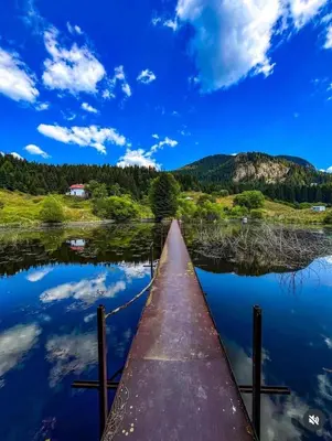 a pier over a body of water at Къща за гости Иглика in Trigrad