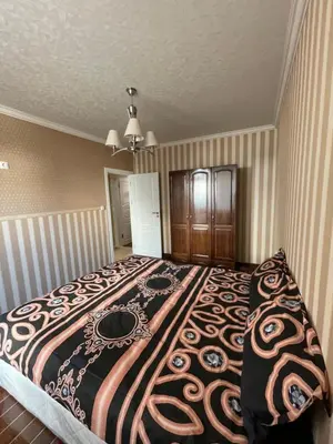 a bedroom with a large bed in a room at Apart 47 in Smolyan