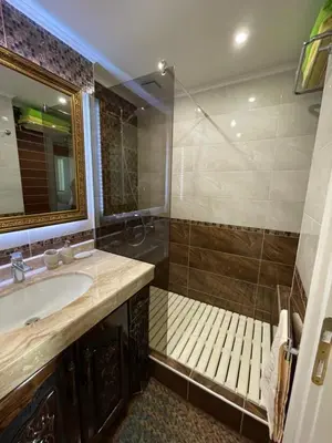 a bathroom with a sink and a shower at Apart 47 in Smolyan