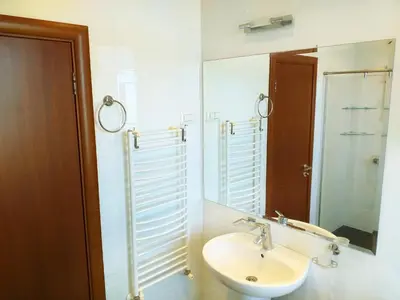 a bathroom with a sink and a mirror at Стаи за Гости Lavender Lozen in Lozen
