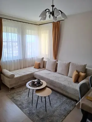 a living room with a couch and a table at The View in Sandanski