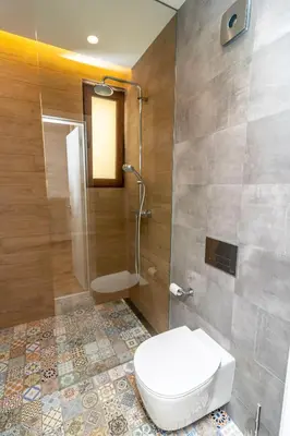 a bathroom with a toilet and a shower at Exclusive Top Central Studio in Sofia