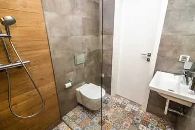 a bathroom with a shower and a toilet and a sink at Exclusive Top Central Studio in Sofia