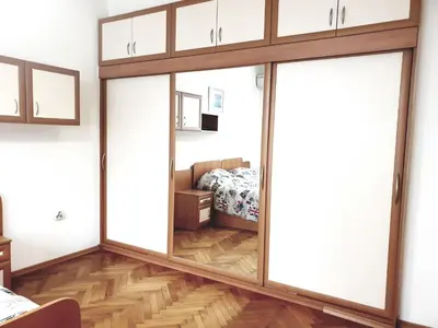 a room with a sliding glass door leading to a bedroom at Jasmine appart Metro station, 2BDR, FREE Parking in Sofia