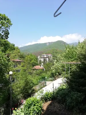 a view of a road with a mountain in the background at Дом Бакалски-Кмета in Narechenski Bani