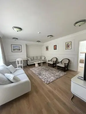 a living room with a couch and a table at FELIX KANITZ Apartments - in the heart of Kapana district in Plovdiv