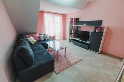 a living room with a couch and a glass table at New & Comfortable home in Blagoevgrad center in Blagoevgrad