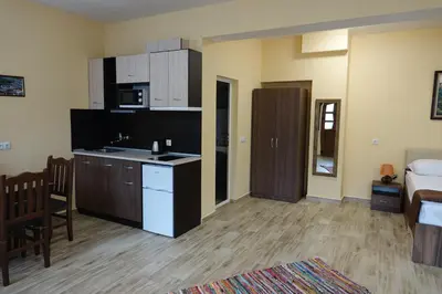 a living room with a kitchen and a bedroom at Борник Хил / Bornik Hill in Devin