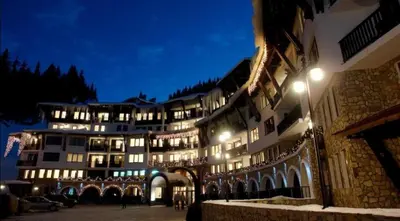a large building at night with lights on at Ski-in ski-out Studio 2A7 Grand Monastery in Pamporovo