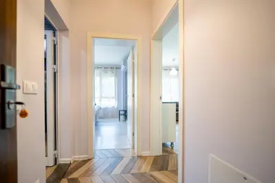 an open hallway with white walls and wood floors at Sunny Apartment in Studentski grad, behind UNSS in Sofia