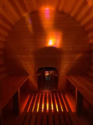 an inside of a sauna with a wood stove at ECO HOUSES ART OF LIVING - Еко къщи изкуството да живееш in Pamporovo