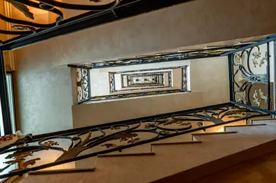 a stairwell with a painting on the wall at Hotel CITY Petrich in Petrich