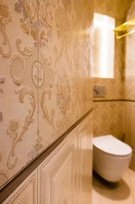 a bathroom with a toilet on a wall at THE HIDDEN BANK: Silver Bullet in Plovdiv