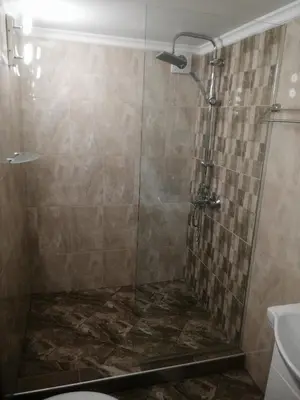 a bathroom with a shower with a toilet and a sink at дом Тодор и Тота Мутевски in Troyan