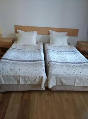 two beds sitting next to each other in a room at Apart Hotel Flora Residence - Clover Building Flat 09 in Borovets