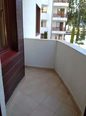 an empty balcony of a building with a door at Apart Hotel Flora Residence - Clover Building Flat 09 in Borovets