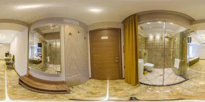 a large bathroom with two mirrors and a toilet at HIDDEN BANK: Golden in Plovdiv