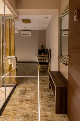 a bathroom with a shower and a glass door at HIDDEN BANK: Golden in Plovdiv