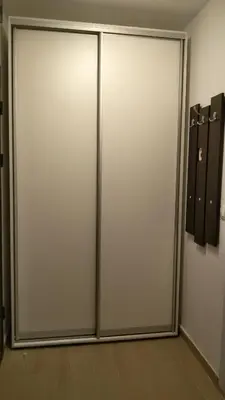 a pair of sliding doors in a room at Парк Апартаменти Юлия in Sandanski