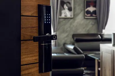 a door handle in a living room with a couch at SOHO Apart House in Plovdiv