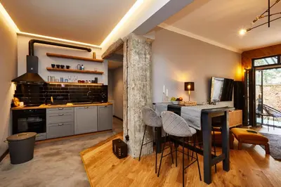 a kitchen with a table and chairs in a room at COURTHOUSE #4 EXCLUSIVE Top Center PRIVATE GARDEN in Sofia