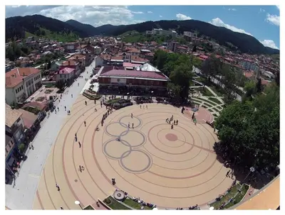 an aerial view of a clock tower in a city at Palyongov Guest House in Chepelare