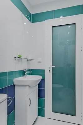 a bathroom with a sink and a glass shower at Bright Apartment in the Heart of the City by Flat Mаnager in Sofia