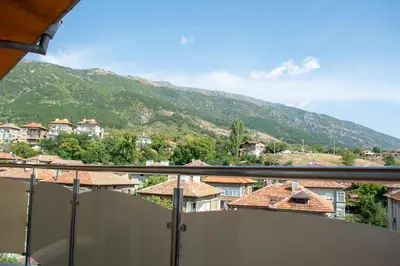a view from a balcony of a town with a mountain at Central Apartment Mountain View in Karlovo