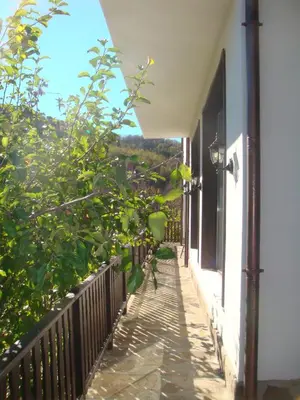 a balcony of a house with a view at Family Hotel and Restaurant Plamena in Oreshak