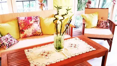 a living room with a couch and a vase on a table at Apartment Nicole in Plovdiv