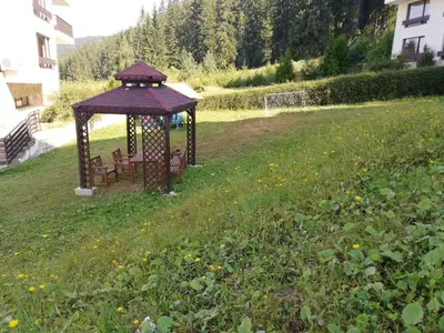 a gazebo in the middle of a field at Dobi's Apartment Elit47 at Elit Pamporovo in Pamporovo