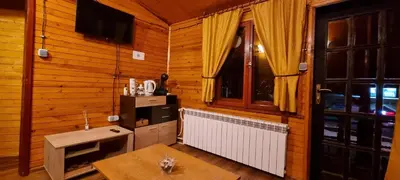a room with a table and a window at The Green King in Borovets
