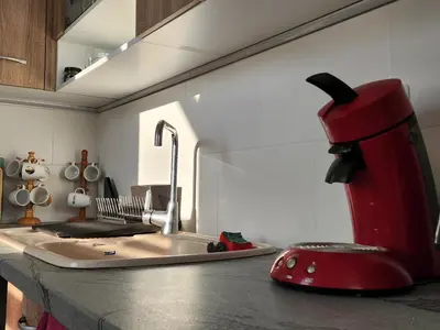 a kitchen with a red appliance on a counter at Villa 