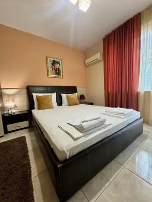 a bedroom with a large bed with towels on it at Venis House in Plovdiv
