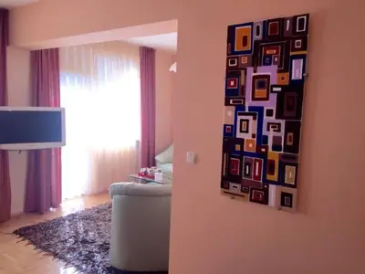 a painting on the wall of a living room at Venis House in Plovdiv