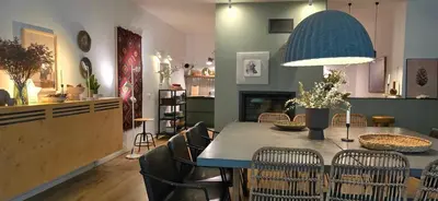 a kitchen and dining room with a table and chairs at GORA - Вила Villa for 22 Guests, Пампорово, Rhodope Mountains in Progled