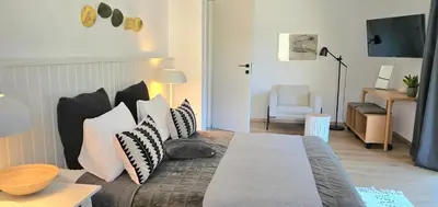 a bedroom with a bed with pillows on it at GORA - Вила Villa for 22 Guests, Пампорово, Rhodope Mountains in Progled