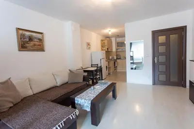a living room with a couch and a table at Karastoyanovi's Apartment in Sofia